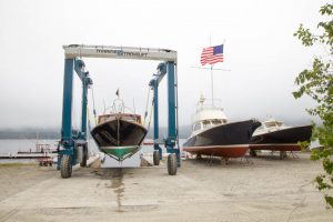 Boat on Travelift by two boats